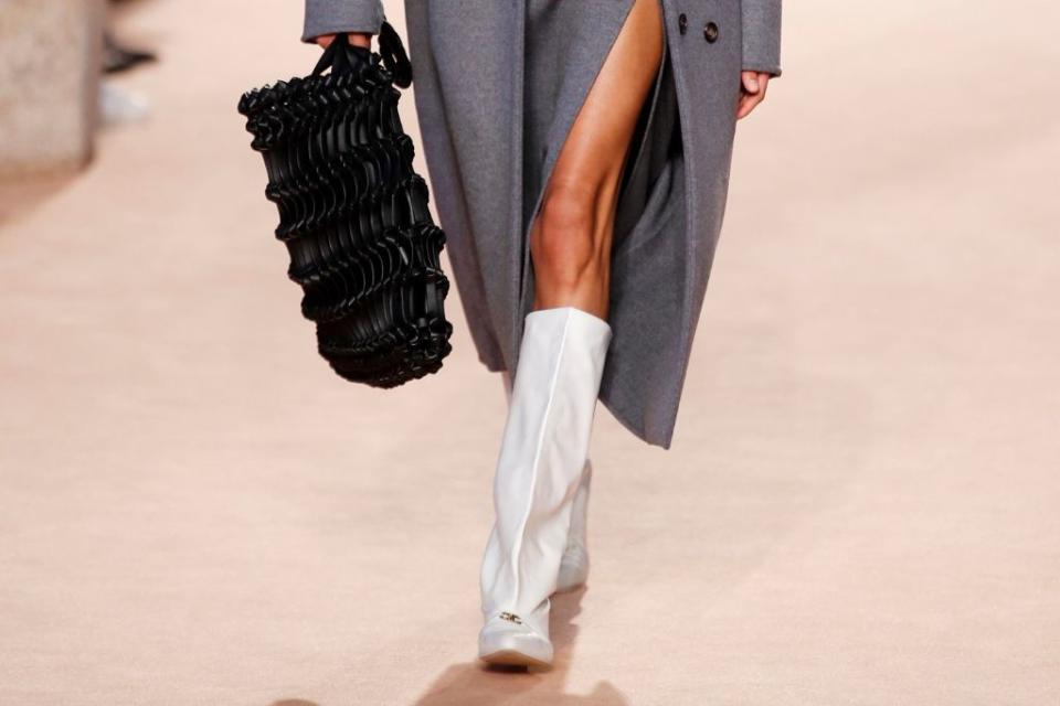 White leather boots and a leather netted bag at Salvatore Ferragamo fall ’20. - Credit: Shutterstock