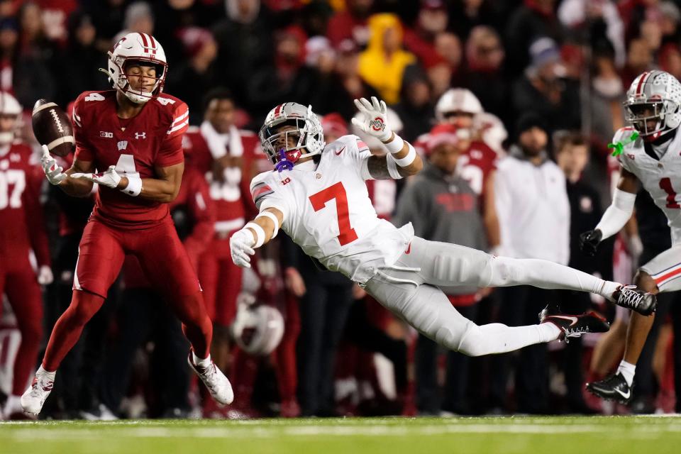 Ohio State cornerback Jordan Hancock defends a pass intended for Wisconsin receiver C.J. Williams.