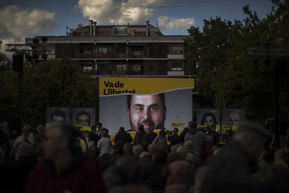 A portrait of Republican Left party leader Oriol Junqueras displayed on stage before a broadcast of him live from a prison in Madrid, as he takes part during a closing election campaign event in Barcelona, Spain, Friday, April 26, 2019. Appealing to Spain's large pool of undecided voters, top candidates on both the right and left are urging Spaniards to choose wisely and keep the far-right at bay in Sunday's general election. (AP Photo/Emilio Morenatti)