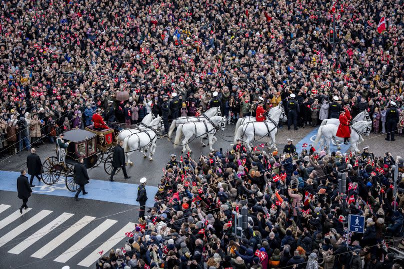 Denmark's Queen Margrethe is escorted by the Guard Hussar Regiment's Mounted Squadron in the gold carriage from Amalienborg Castle to Christiansborg Castle in Copenhagen