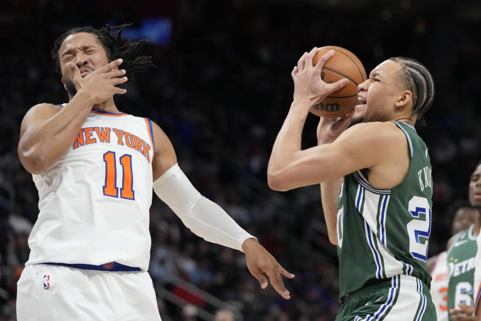 New York Knicks guard Jalen Brunson (11) reacts after a check from Detroit Pistons forward Kevin Knox II during the first half of an NBA basketball game, Sunday, Jan. 15, 2023, in Detroit. (AP Photo/Carlos Osorio)