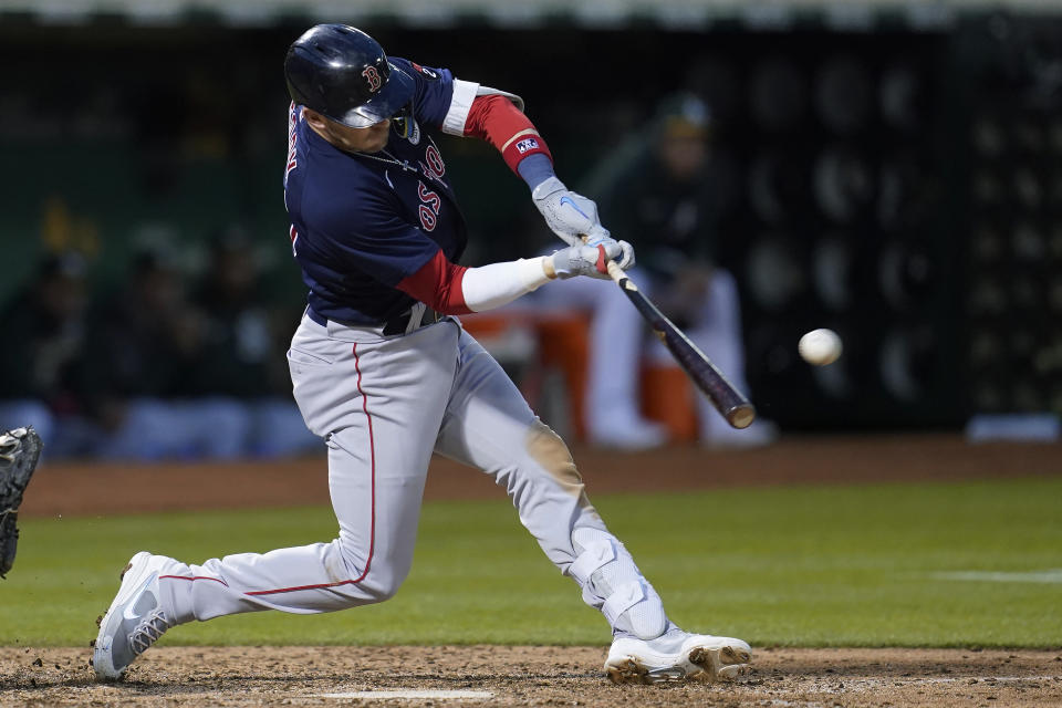 Boston Red Sox's Trevor Story hits a two-run double against the Oakland Athletics during the sixth inning of a baseball game in Oakland, Calif., Friday, June 3, 2022. (AP Photo/Jeff Chiu)