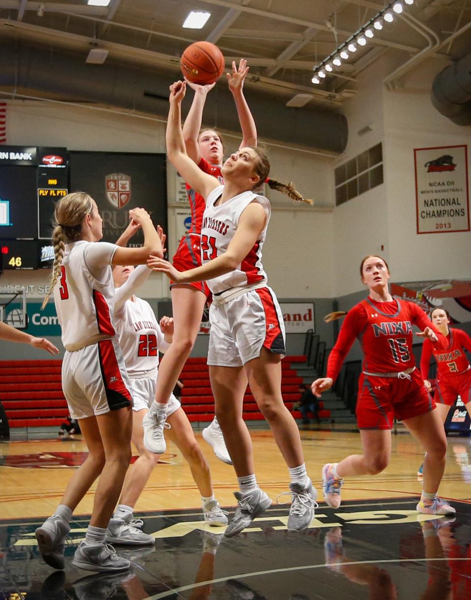 Norah Clark of Nixa High School shoots the ball during the Pink & White Lady Basketball Classic semifinals at the O'Reilly Family Event Center on Thursday, Dec. 29, 2022.