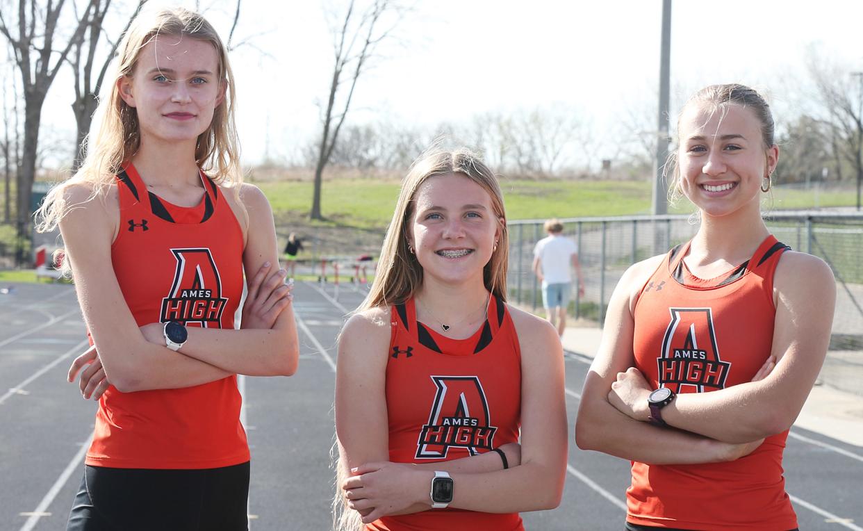 Juniors Lauren Risdal (left) and Marley Turk (right) have been a huge positive influence on Ames freshman distance runner Emma Stanley (center). The three runners are part of an Ames girls 4x800-meter relay team that, through Wednesday, was ranked 11th in Class 4A, according to Varsity Bound.