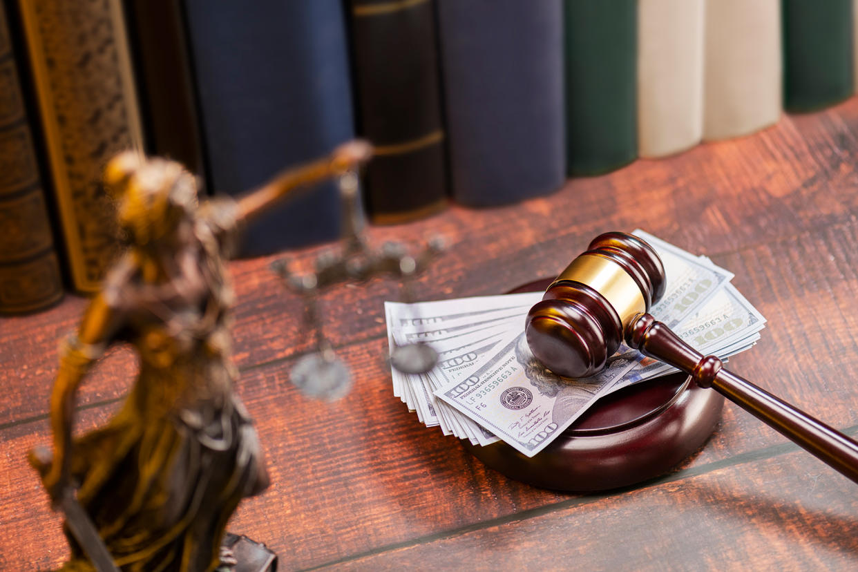 scales-of-justice-money-gavel-1800 - Credit: Getty Images/iStockphoto