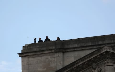 Police of the roof of Buckingham Palace, London, during the first day of a state visit to the UK by US  - Credit: Steve Parsons/PA