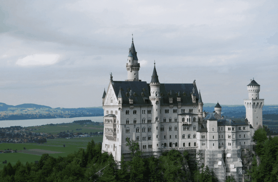 Neuschwanstein Castle in Germany is somewhat the worse for wear after Nightmare Machine's algorithms are done with it. <cite>Nightmare Machine</cite>