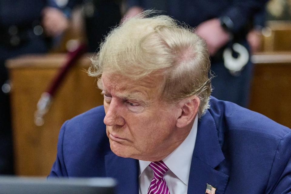 Donald Trump attends the final day of jury selection on Friday 19 April (EPA)