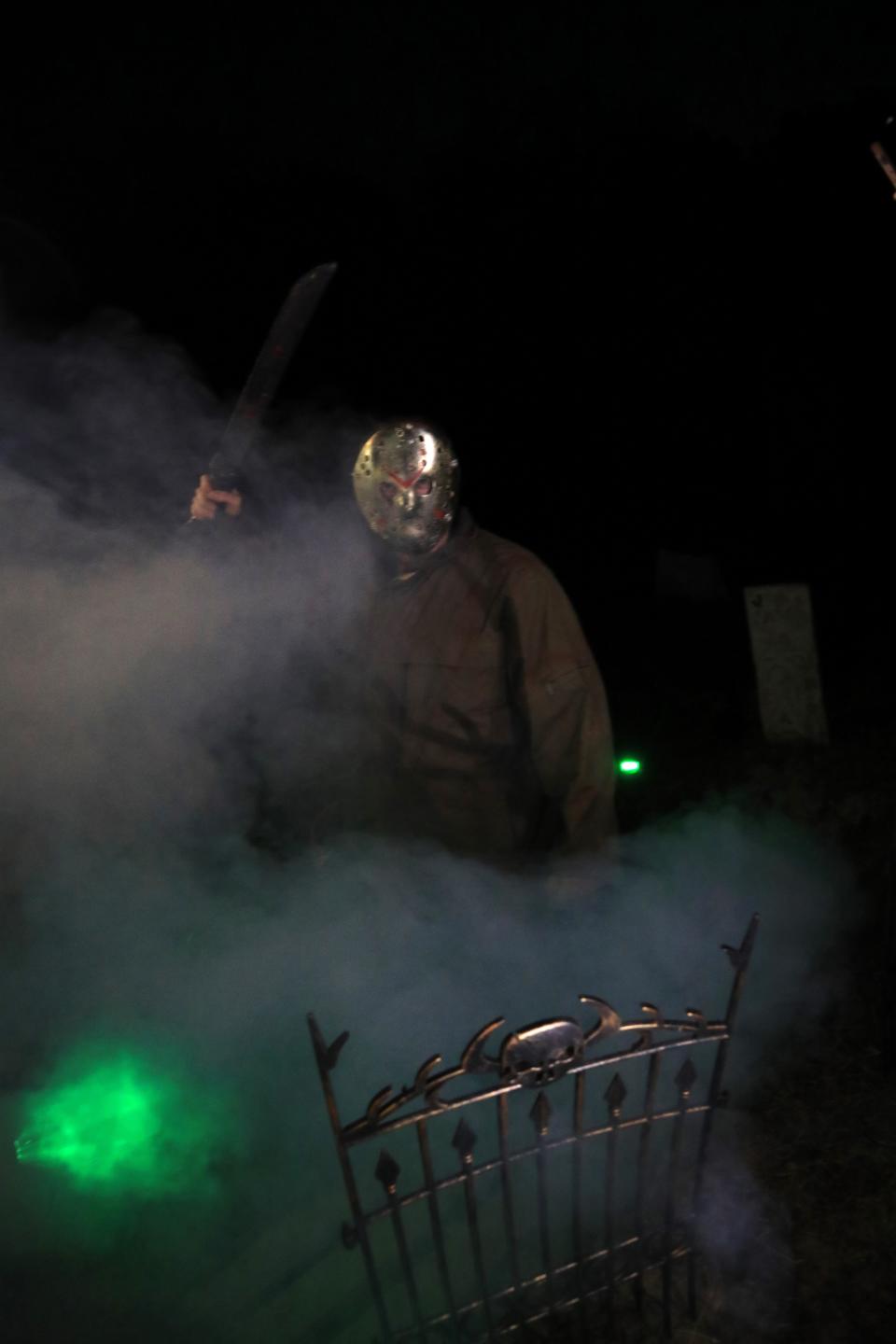 Zachary Eddens performs as "Jason Voorhees" on Wednesday, Oct. 18, 2023 for the R & P Haunted Farm the Halloween season in Woodlawn, Tennessee.