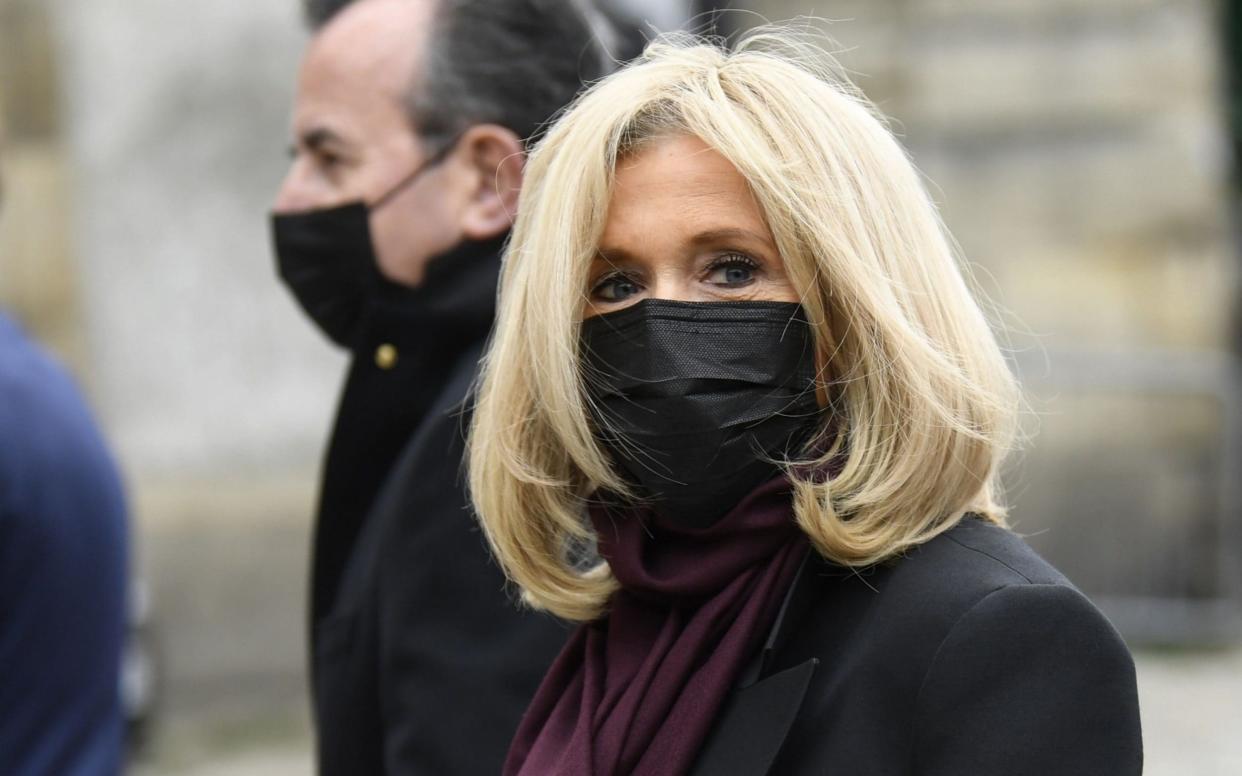 Brigitte Macron, pictured in Paris earlier this month, is showing no symptoms - AFP