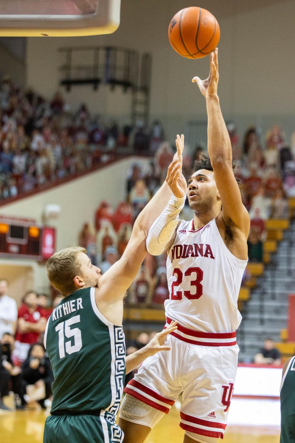 Feb 20, 2021; Bloomington, Indiana, USA; Indiana Hoosiers forward Trayce Jackson-Davis (23) shoots the ball over Michigan State Spartans forward Thomas Kithier (15) in the first half at Simon Skjodt Assembly Hall. Mandatory Credit: Trevor Ruszkowski-USA TODAY Sports