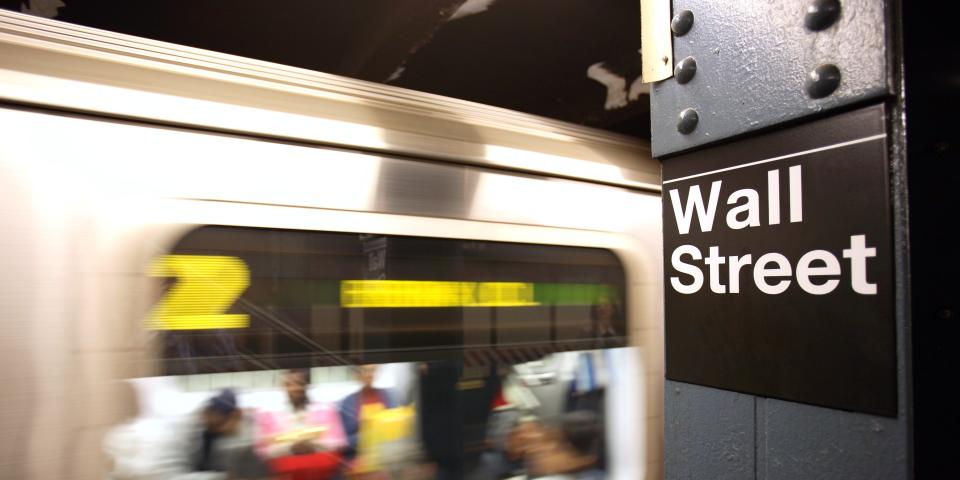 Wall Street sign on the subway