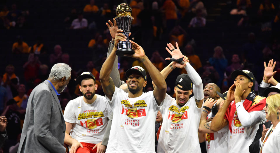 Kawhi Leonard hoists the Bill Russell MVP Trophy after defeating the Golden State Warriors in Game Six of the NBA Finals in June. (Photo by Jesse D. Garrabrant/NBAE via Getty Images)