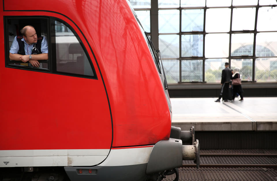 BERLIN, GERMANY - AUGUST 10: A regional (RB) train driver looks out of his window at Berlin's main train station, or Hauptbahnhof, on August 10, 2021 in Berlin, Germany. Ninety-five percent of the Gewerkschaft Deutscher Lokomotivführer (GDL) train drivers' union members voted in favor of a strike affecting cargo and passenger trains expected to last 48 hours, as they call for a 3.2% salary increase and a one-time “coronavirus bonus” of 600 euros (703 USD). (Photo by Adam Berry/Getty Images)