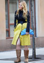 Celebrity fashion: From the head down, Blake Lively’s look is near perfect… the lemon and black Reed Krakoff coat, the baby-blue Emily Cho python clutch and then we spy her footwear. Filming Gossip Girl is no excuse these boots ruin it.