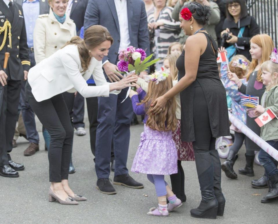 The Duke and Duchess of Cambridge visit the Cridge Centre for the Family and meet with flower girl Brynn Naylor, 4, during a tour of the centre in Victoria, B.C., Saturday, October 1, 2016. THE CANADIAN PRESS/Chad Hipolito