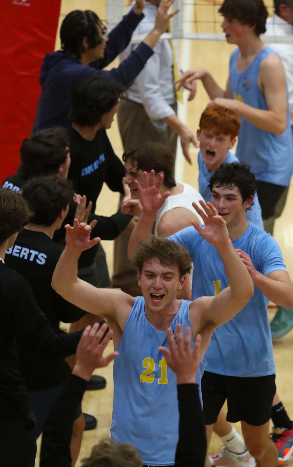 Cape Henlopen's Dylan Henry (front) and Brady Lamb join the celebration after the Vikings' 3-0 win against Salesianum for the first DIAA Boys Volleyball Tournament title on May 23 at Smyrna High.