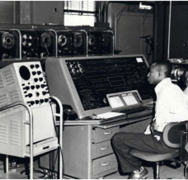 Roy programming early generation computer at Control Data Corporation in the late '50s. Cover photo for book.