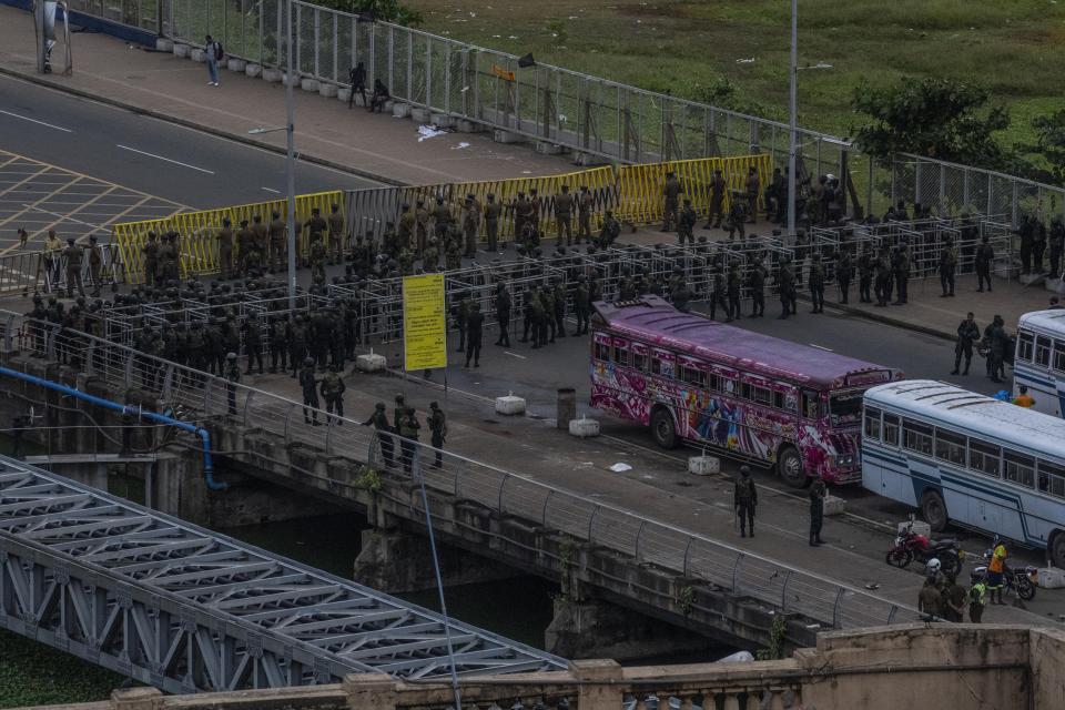 Army soldiers stand guard after removing the protesters and their tents from the site of a protest camp outside the Presidential Secretariat in Colombo, Sri Lanka, Friday, July 22, 2022. (AP Photo/Rafiq Maqbool)