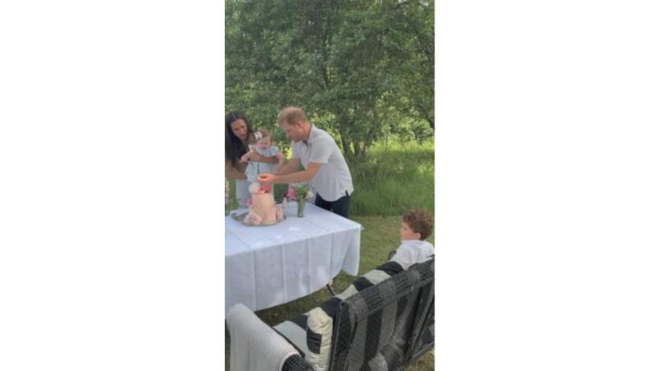 Prince Harry Meghan Markle Princess Lilibet blowing cake