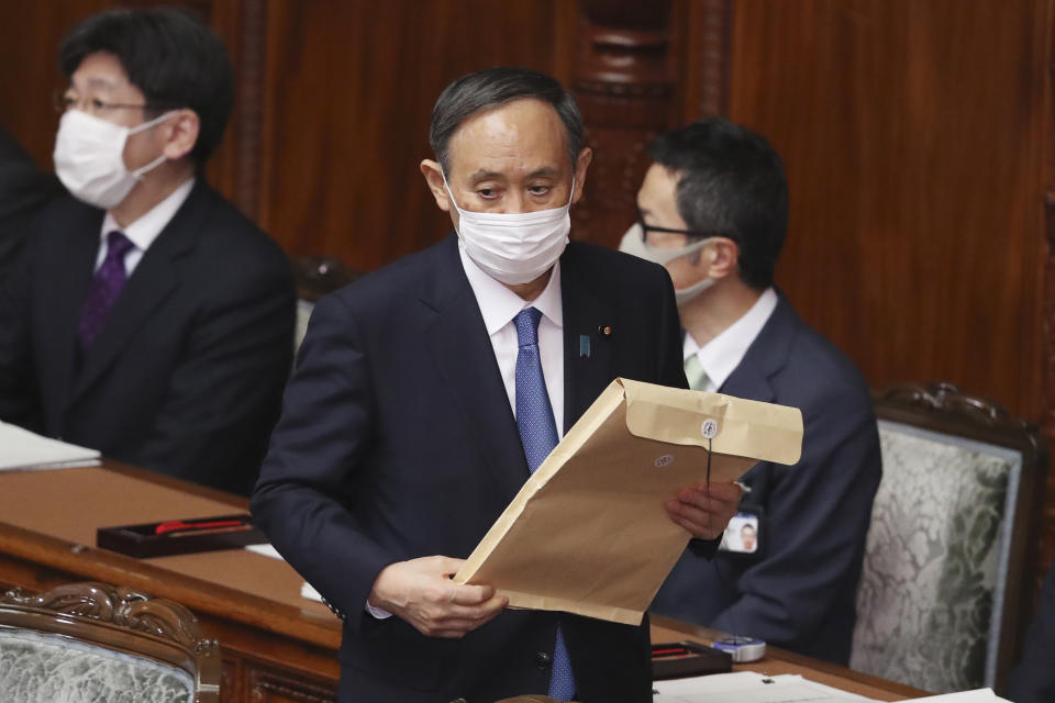 Japanese Prime Minister Yoshihide Suga attends an ordinary Diet session at the upper house of parliament in Tokyo, Monday, Jan. 18, 2021. (AP Photo/Koji Sasahara)