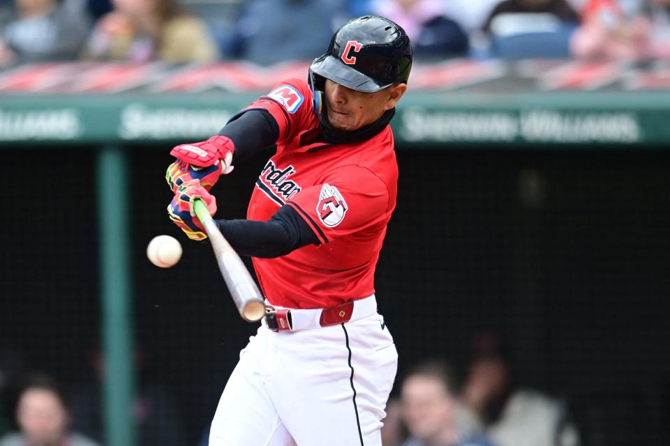 Guardians second baseman Andres Gimenez hits an RBI single during the third inning against the Oakland Athletics, April 21, 2024, in Cleveland.