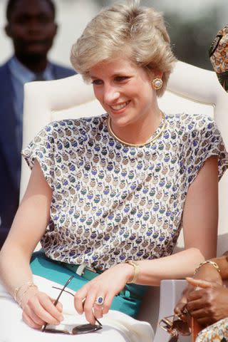 <p>Tim Graham Photo Library via Getty</p> Princess Diana in Lagos, Nigeria, on March 16, 1990