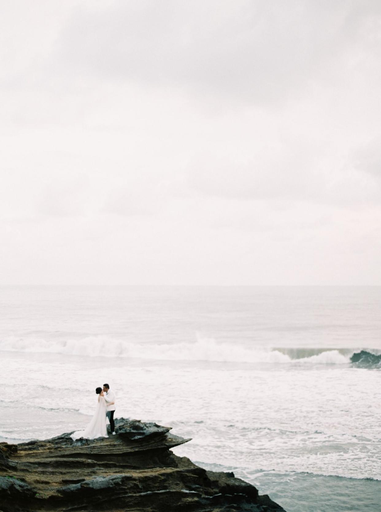 vivi yoga bali wedding ceremony couple ocean rocks