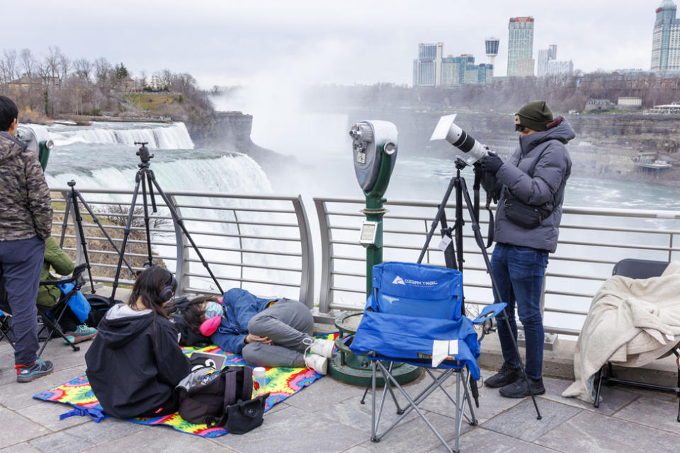 People camp out at Prospect Point hours before the total solar eclipse in Niagara Falls, New York, USA