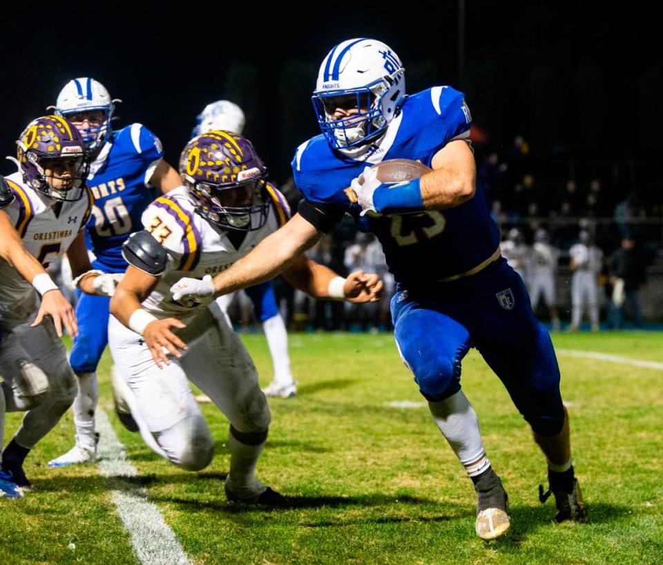 Ripon Christian’s Grant Sonke (25) breaks around Orestimba’s Nicolas Cuevas (33) in the Sac-Joaquin Section Division VII-A Championship against Orestimba at Ripon Christian High School on Friday, Nov. 17, 2023.