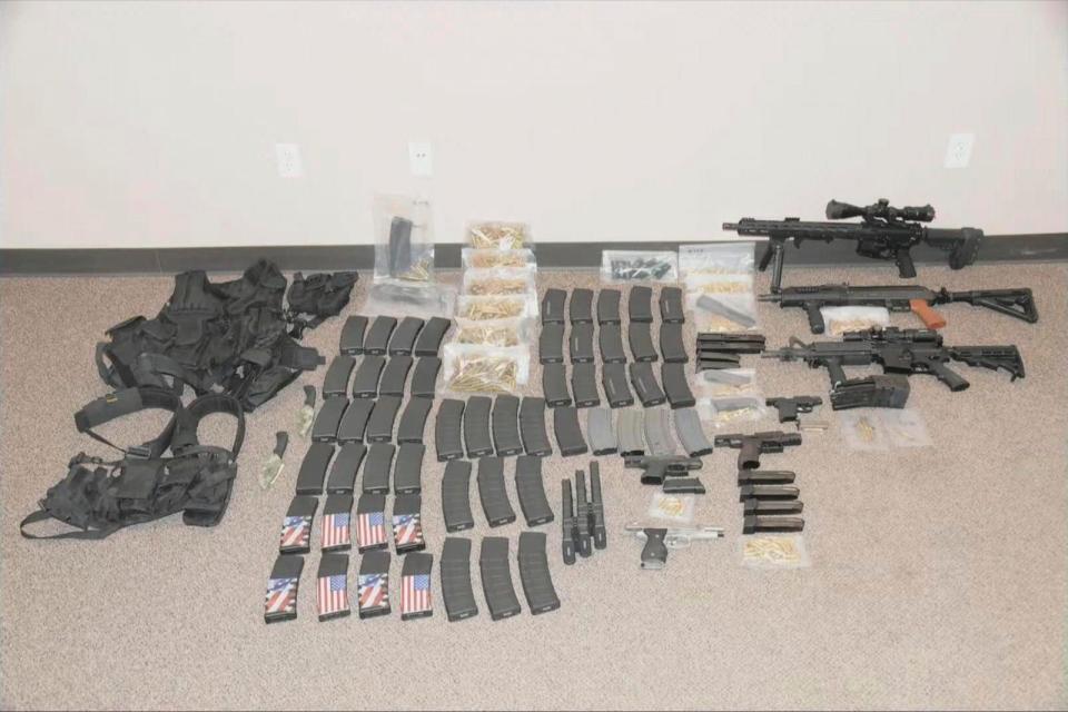 PHOTO: This photo released by the North Dakota Bureau of Criminal Investigation on July 19, 2023, shows the cache of weapons and ammunition that authorities recovered from the car of a man who opened fire on Fargo, N.D., police officers. (North Dakota Bureau of Criminal Investigation via AP)