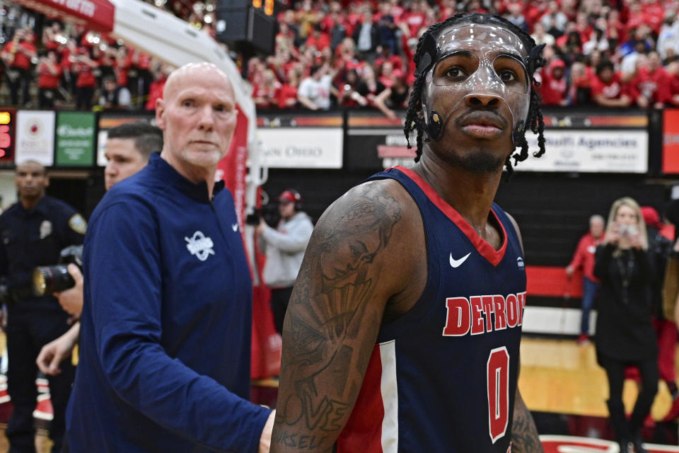 Detroit Mercy guard Antoine Davis, right, walks off the floor after his team was defeated by Youngstown State in an NCAA college basketball game in the quarterfinals of the Horizon League tournament Thursday, March 2, 2023, in Youngstown, Ohio. (AP Photo/David Dermer)
