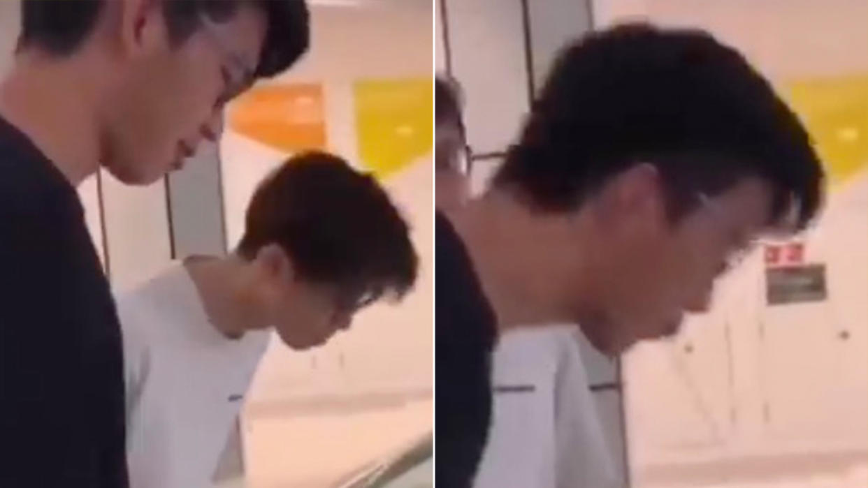 Screengrabs from the video showing a male teenager spitting inside a shopping mall.