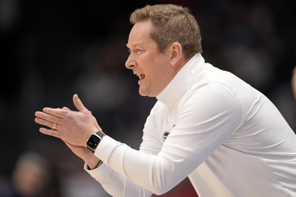 Colorado State coach Niko Medved applauds during the first half of the team's First Four college basketball game against Virginia in the men's NCAA Tournament, Tuesday, March 19, 2024, in Dayton, Ohio. (AP Photo/Jeff Dean)