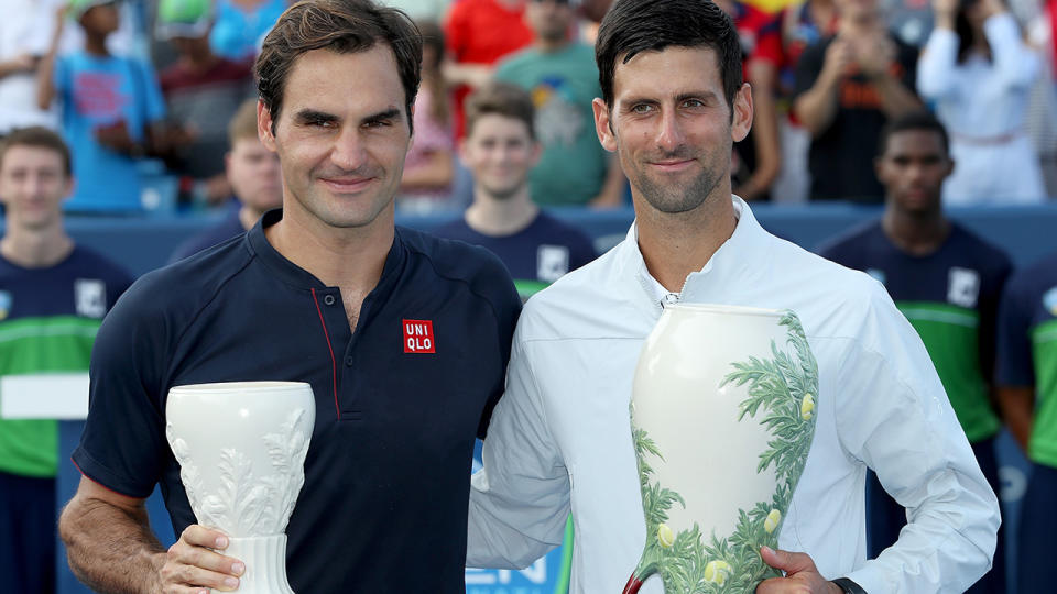 Roger Federer and Novak Djokovic pose for photographers after their match during the men’s final of the Western & Southern Open at Lindner Family Tennis Center on August 19, 2018 in Mason, Ohio. (Photo by Matthew Stockman/Getty Images)