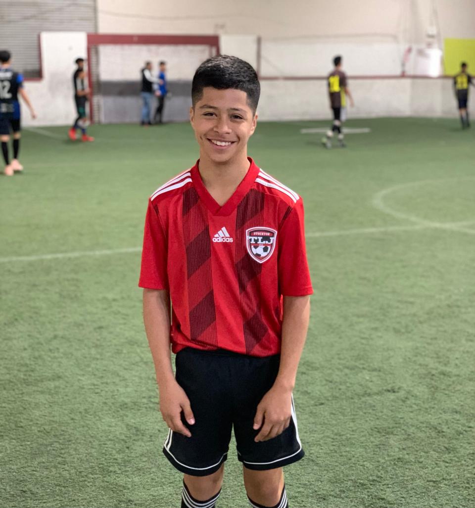 Alex Alcala, at a younger age poses for a photo wearing his Stockton TLJ FC Rebels uniform.