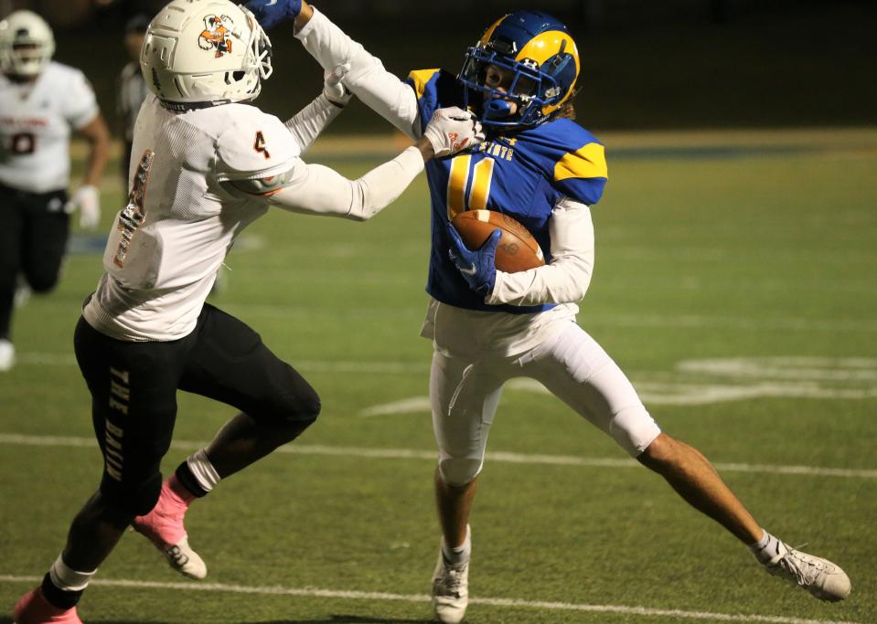 Angelo State University wide receiver Kellen Pachot, right, fights for yardage against UT Permian Basin in a homecoming contest at LeGrand Stadium at 1st Community Credit Union Field on Saturday, Oct. 16, 2021.