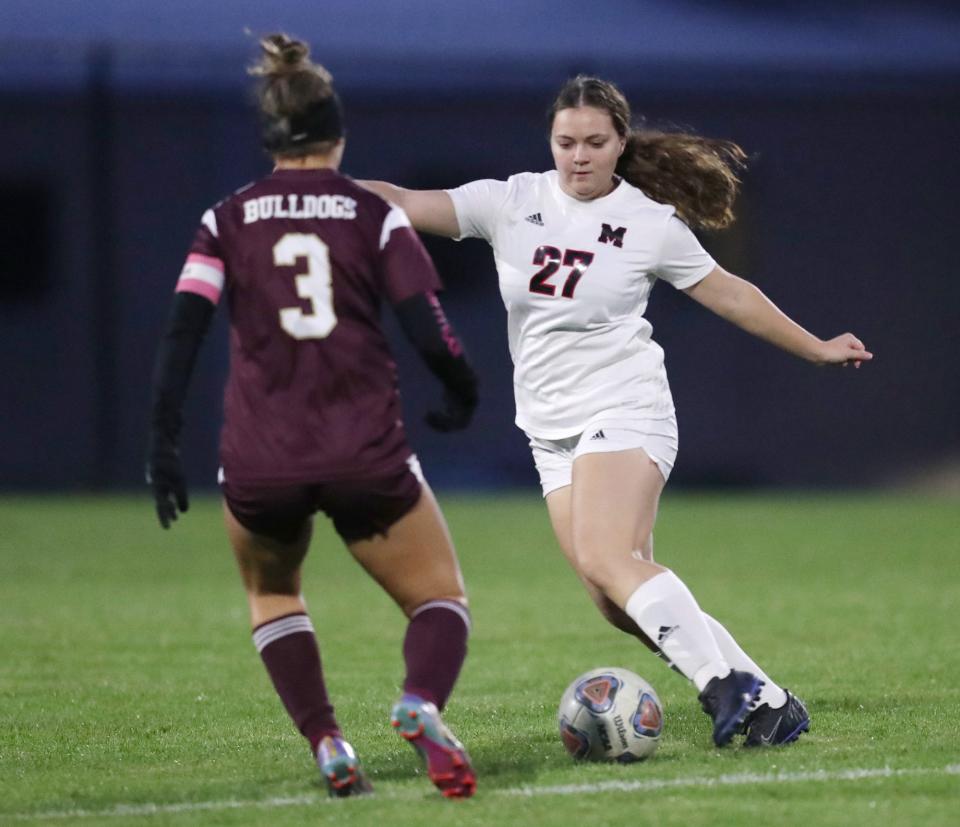 Stow’s Paityn Marino defends Manchester’s Carrie Clark in the first half, Monday, Oct. 9, 2023.