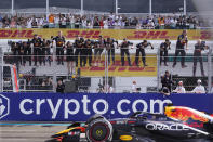 Red Bull mechanics and crew cheer as Red Bull driver Max Verstappen of the Netherlands crosses the finish line to win the Formula One Miami Grand Prix auto race at the Miami International Autodrome, Sunday, May 8, 2022, in Miami Gardens, Fla. (AP Photo/Wilfredo Lee)