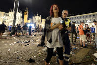 <p>Juventus supporters evacuate Piazza San Carlo after a panic movement in the fanzone where thousands of Juventus fans were watching the UEFA Champions League Final football match between Juventus and Real Madrid on a giant screen, on June 3, 2017 in Turin. (Massimo Pinca/AFP/Getty Images) </p>