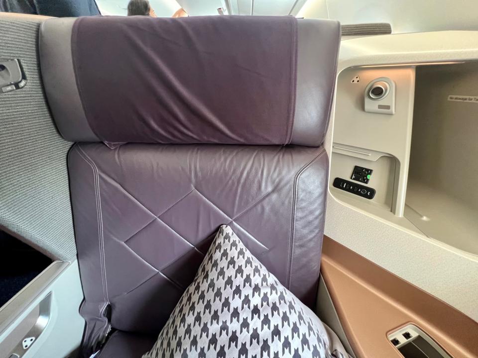 The giant purple business class seat.