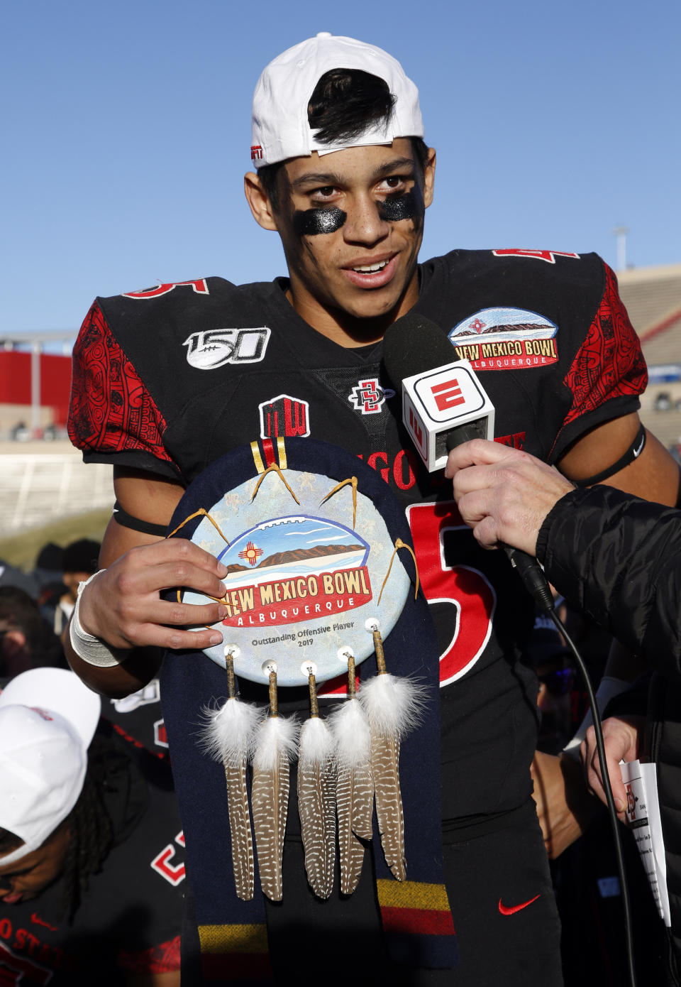 San Diego State wide receiver Jesse Matthews, one of the two recipients of the offensive MVP award, speaks during the presentation of the New Mexico Bowl NCAA college football game on Saturday, Dec. 21, 2019 in Albuquerque, N.M. San Diego State beat Central Michigan 48-11. (AP Photo/Andres Leighton)