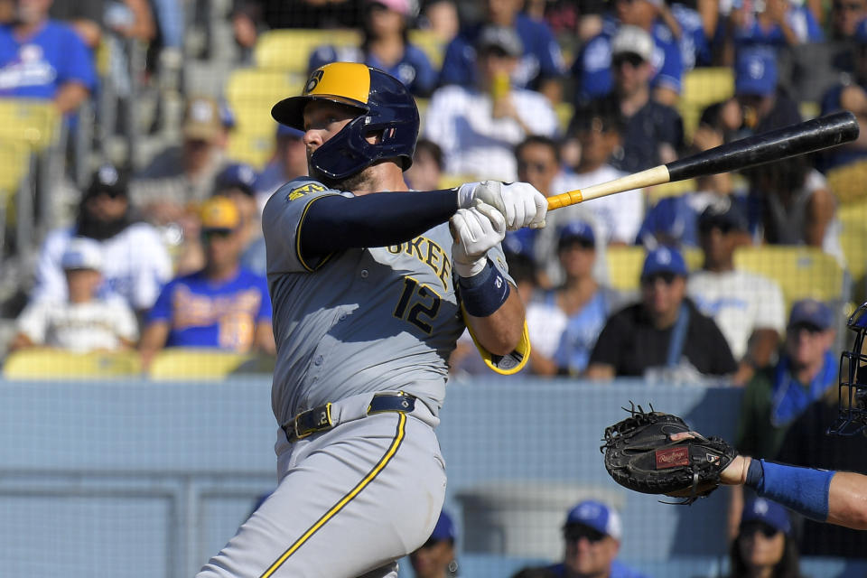 Milwaukee Brewers' Rhys Hoskins follows through for a solo home run during the fourth inning of a baseball game against the Los Angeles Dodgers Saturday, July 6, 2024, in Los Angeles. (AP Photo/Mark J. Terrill)