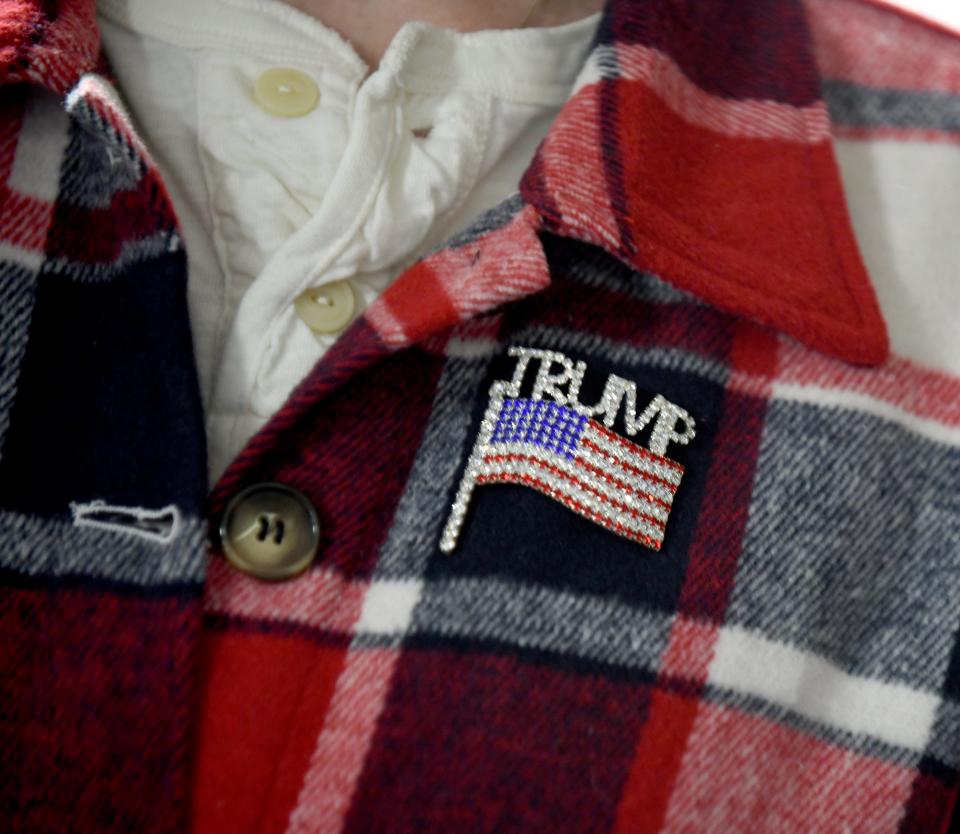 A Trump pin on a visitor at Friday's ReAwaken America Tour stop in Canton.