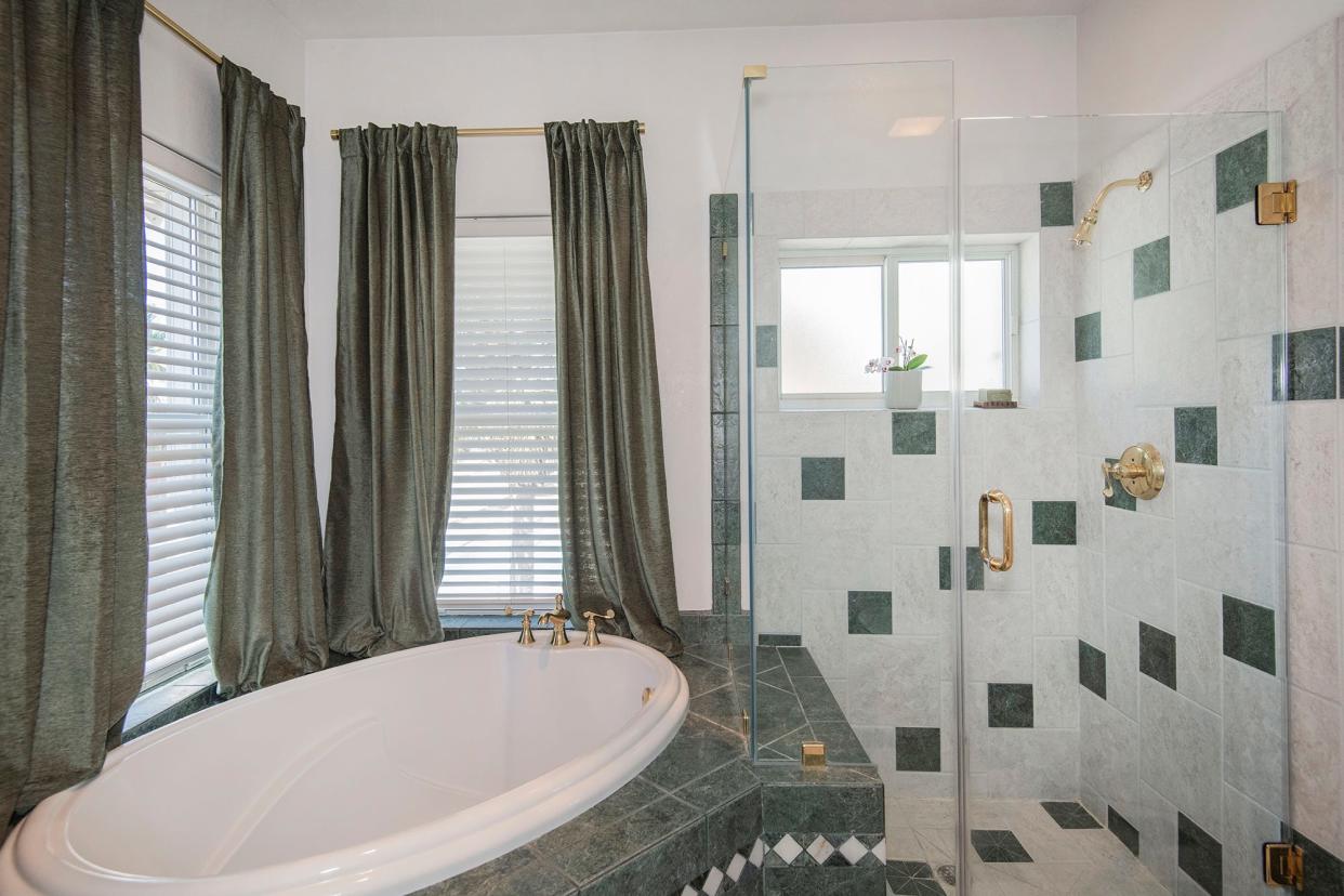 Master bath with soaking tub and walk-in shower