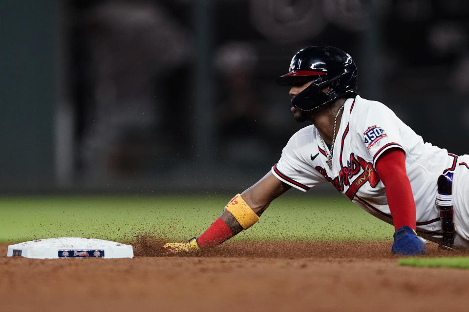 Atlanta Braves' Ronald Acuna Jr. steals second base during the ninth inning of the team's baseball game against the Boston Red Sox on Tuesday, June 15, 2021, in Atlanta. (AP Photo/John Bazemore)