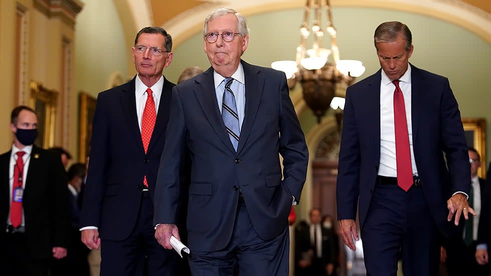 Sen. John Barrasso (R-Wyo.), Minority Leader Leader Mitch McConnell (R-Ky.) and Sen. John Thune (R-S.D.) arrive for a press conference after the weekly policy luncheon on Tuesday, September 28, 2021.