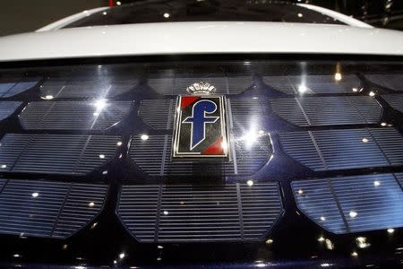 The logo of Italian design company Pininfarina is pictured on the bonnet of a BO Pininfarina-Bollore electric concept car is displayed during the second media day of the 79th Geneva Car Show at the Palexpo in Geneva March 4, 2009. REUTERS/Arnd Wiegmann/Files