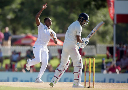 Cricket - India v South Africa - Second Test match - Centurion Stadium, Pretoria, South Africa - January 16, 2018. South Africa’s Lungi Ngidi celebrates taking the wicket of India’s Lokesh Rahul. REUTERS/James Oatway