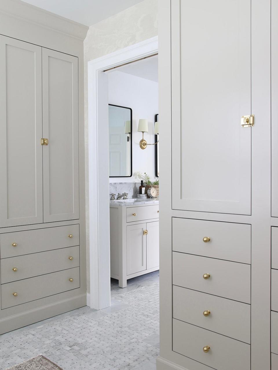 gray-beige closets outside of bathroom